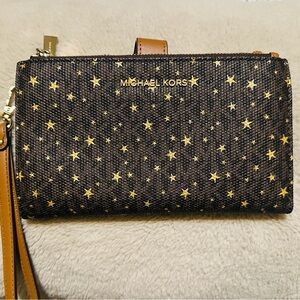 “Michael Kors Wallet”
Carry your phone in style with this chic accessory.